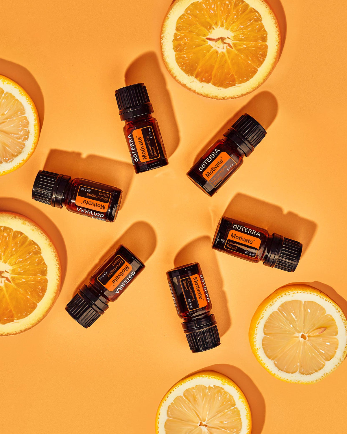 Motivate mélange d'huiles essentielles dōTERRA, flacon avec tranches d'orange